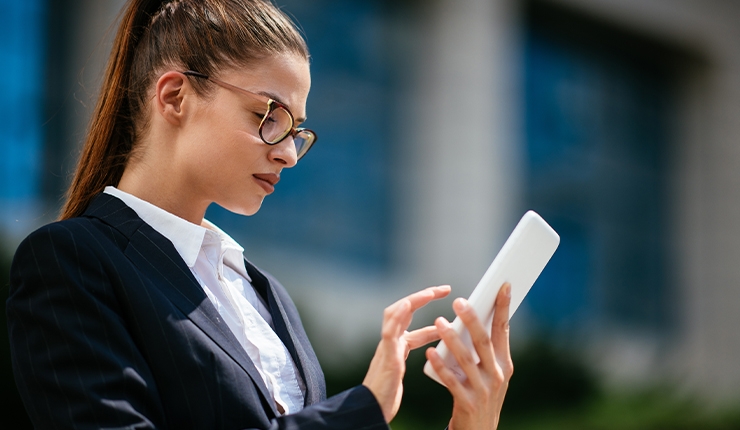 woman looking at mobile device